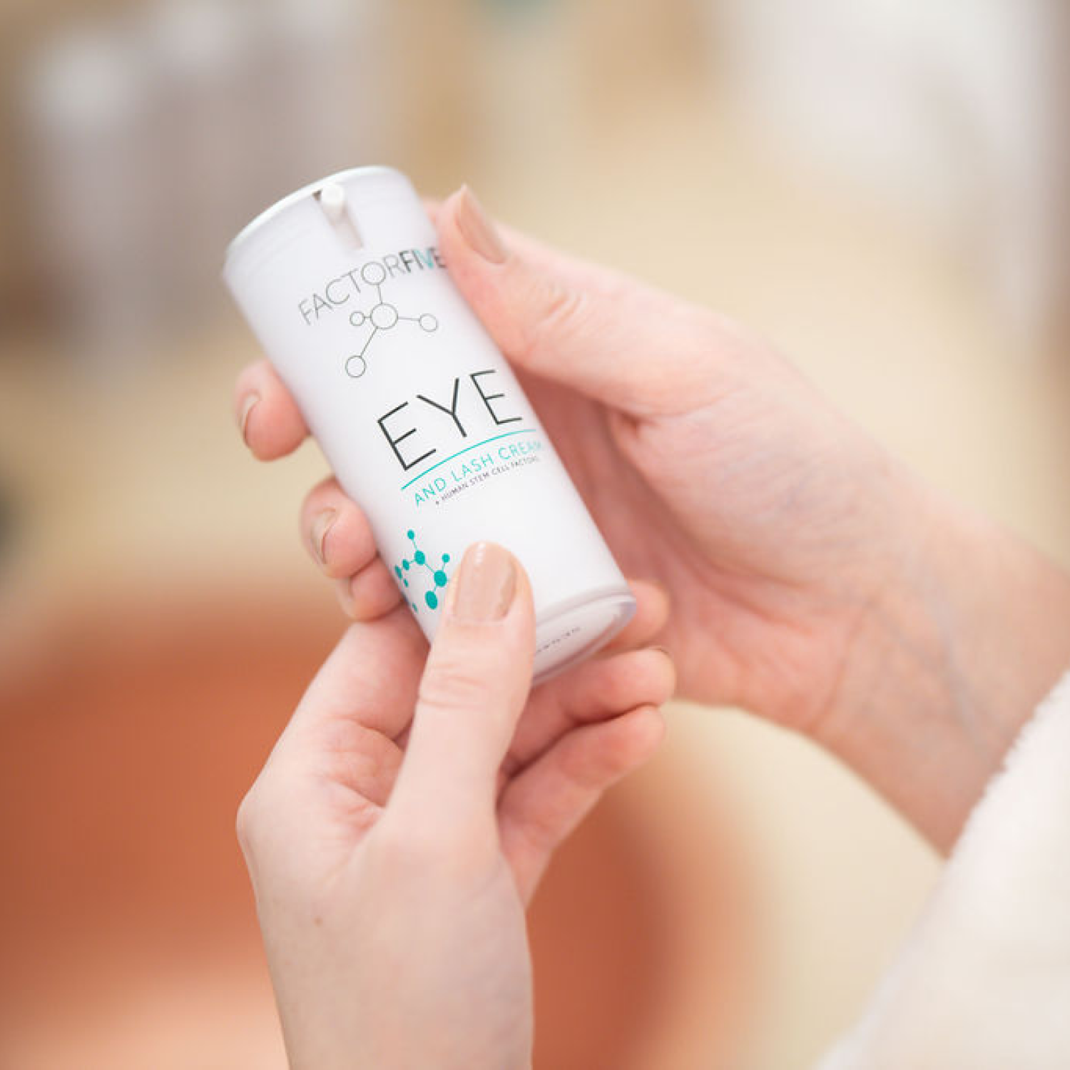 Female holding FACTORFIVE Skincare Eye/Lash Cream